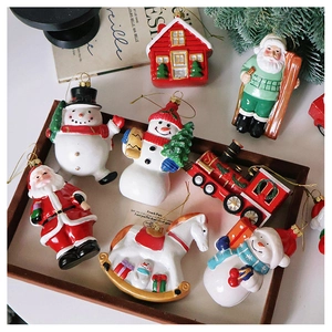Detailed close-up of colorful hand-painted Christmas ornaments in a wooden tray