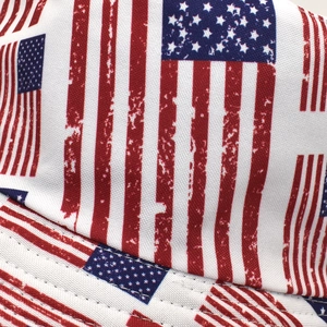 Macro shot of double-stitched canvas fabric with vintage US flag print on a bucket hat