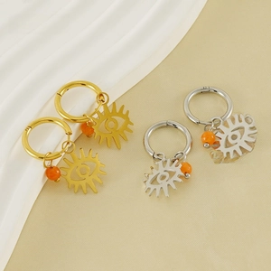 Evil eye hoop earrings in gold and silver finish with orange beads on silk background