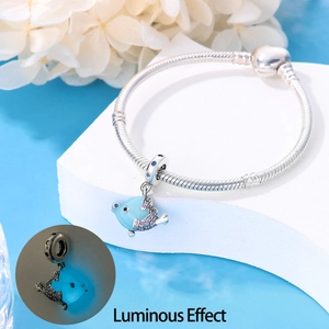 Luminous ocean-themed silver charm bracelet with blue fish pendant and snake chain