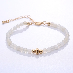Natural milky round bead bracelet with gold accents and adjustable lobster clasp
