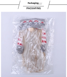 Knitted Christmas gnome wine bottle cover with long beard in transparent OPP packaging