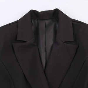 Elegant black double-breasted blazer for women with a slim fit and structured collar