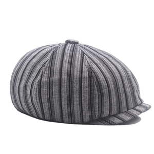 Detail of vintage striped cotton linen newsboy cap showing fabric texture and patterns