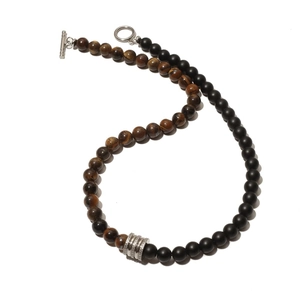 Close-up of 8mm tiger eye and matte obsidian beads necklace with silver toggle clasp