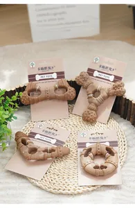 Macro detail of assorted wood-plastic dog chew toys with textured surface and packaging