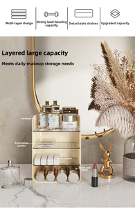 Detail of multi-tier cream makeup organizer with clear acrylic shelves on marble vanity
