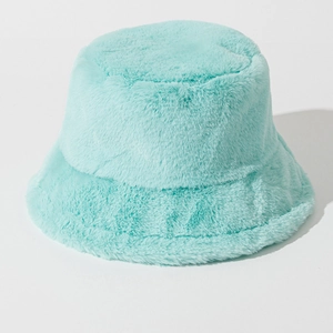 Detailed close-up of mint green faux fur bucket hat showing soft plush texture