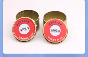 Detail of 24-hour emergency candle in a gold tin can with clear red labeling