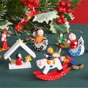 Handcrafted wooden Christmas tree ornaments featuring mini painted puppet figurines