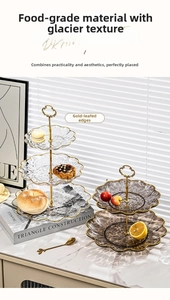 Detail of tiered glass dessert stand with glacier texture and gold-plated edges