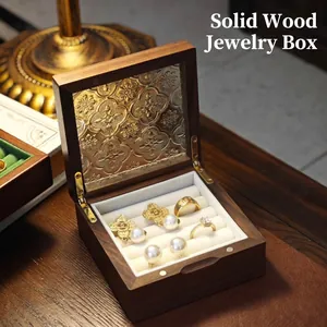 Vintage walnut wood jewelry box with embossed glass lid and ring display slots