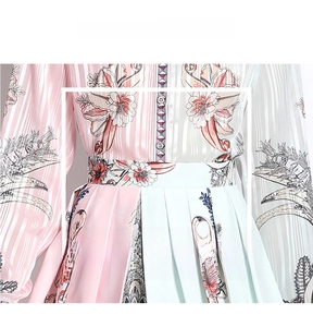 Detail of floral print pleated skirt with vertical jacquard fabric and waist stitching