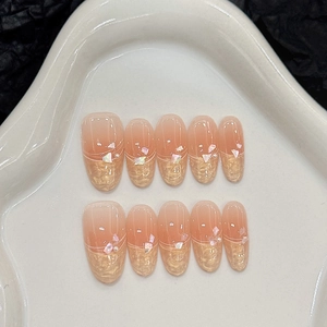 French peach pink gradient press-on nails with gold foil and iridescent sequins