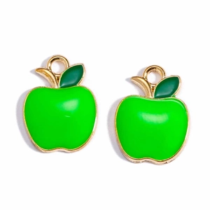 Detail view of two green apple alloy charms with gold edges and loops for DIY jewelry