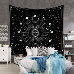 Detail of bohemian sun and moon phase tapestry on a bedroom wall decoration