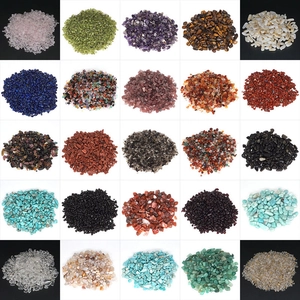 Detailed grid of 25 polished natural crystal chips including amethyst and rose quartz
