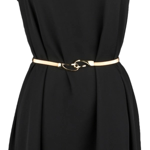 Detail of interlocking gold metal stretch belt cinching the waist of a black dress