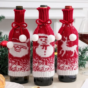 Three-piece knitted Christmas wine bottle covers with Santa, snowman and reindeer designs