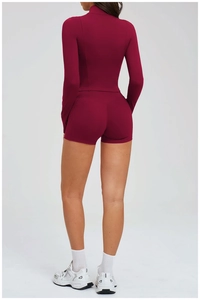Detail view of the back of a deep red athletic set with compression top and shorts