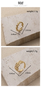 Detailed view of adjustable gold-plated stainless steel hollow leaf and woven rings