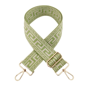 Adjustable wide woven shoulder strap with green meander pattern and gold metal hooks