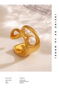 Detailed view of wide gold-plated stainless steel ring with elegant double pearl inlay
