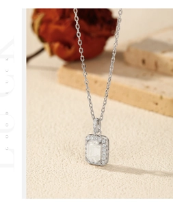 Detailed close-up of emerald-cut moissanite pendant on S925 sterling silver chain
