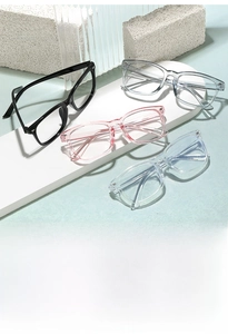 Detail of four retro square blue light glasses in black, grey, pink, and blue resin