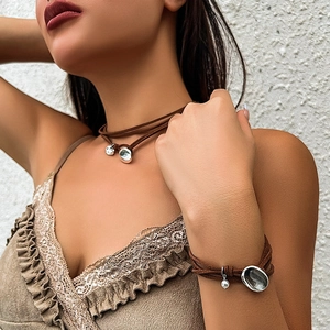 Brown suede double-layer choker and bracelet set with irregular silver metal pendants