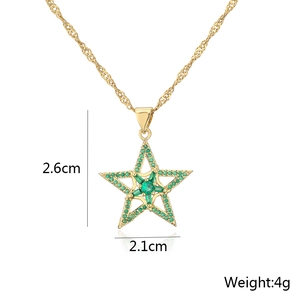 Gold star pendant necklace with green zircon and dimensions 2.6cm x 2.1cm shown on white background