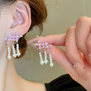 Elegant purple enamel flower earrings with pearl tassels and shimmering zircon accents