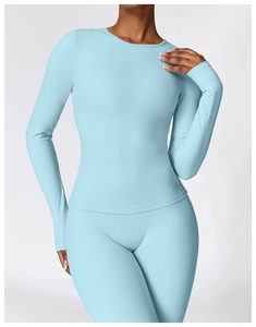 Slim fit long sleeve ice blue yoga set featuring brushed fabric for high intensity workout