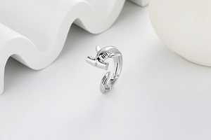 Macro detail of silver hammerhead shark ring with adjustable band and polished finish