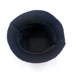 Unisex reversible bucket hat with graffiti pattern and dark interior lining