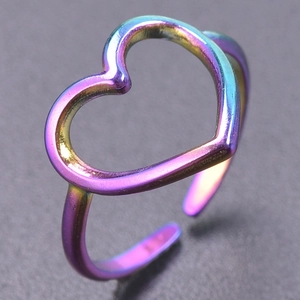 Macro shot of an adjustable heart-shaped open ring with a vibrant rainbow gradient finish