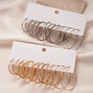 12-piece set of gold and silver hoop earrings with rhinestones and twisted metal textures