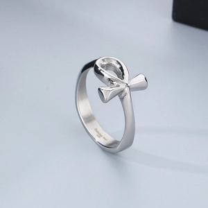Macro shot of silver Ankh cross ring showing stainless steel engraving on inner band