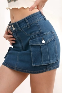 Detail of blue denim mini skirt featuring double metal buttons and cargo side pockets