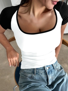 Close-up of Y2K style slim fit short sleeve T-shirt with black and white color block design