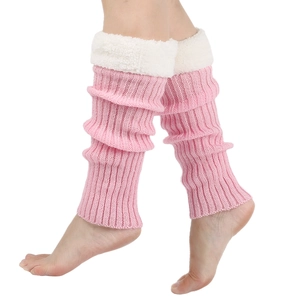 Close-up of pink knitted leg warmers featuring soft white faux fur trim on top edges