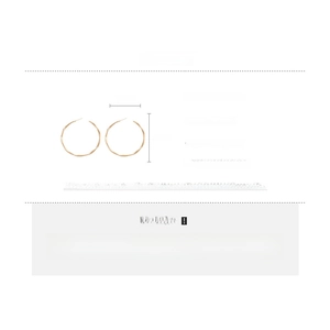 Detailed spec view of 5cm gold twisted hoop earrings made of brass with silver needles