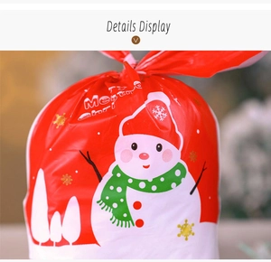 Detail of red Christmas gift bag featuring a cute snowman and Merry Christmas greeting