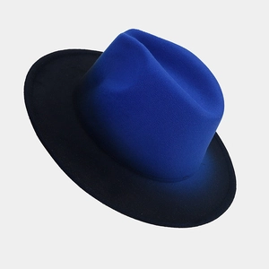 Detail of blue and black gradient wool fedora hat with a wide brim and classic crown