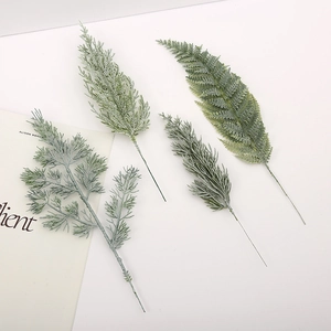 Artificial pine leaves and greenery branches for Christmas and wedding home decoration