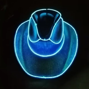 Detail of LED glowing blue fiber optics on a dark holographic neon cowboy party hat