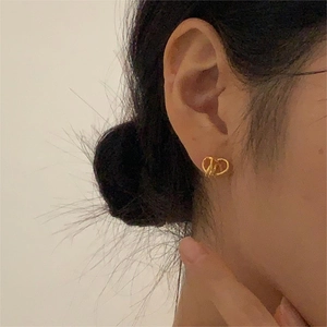 Polished gold interlocking CD knot stud earrings in 925 sterling silver for women