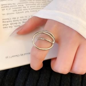 Close-up of geometric double layered silver metal ring with minimalist streamlined design