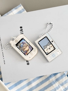 Detail of acrylic photo card holder keychain with retro game console and camera designs