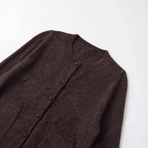 Dark brown knit cardigan with gold buttons and front pockets on white background